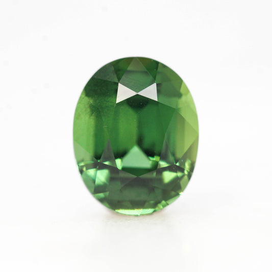 1.74 Carat Warm Green Oval Sapphire for Custom Work - Inventory Code GOS174