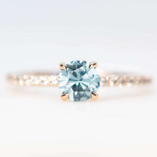 Raine Ring with a 1.03 Carat Round Blue Montana Sapphire and White Accent Diamonds in 14k Rose Gold - Ready to Size and Ship