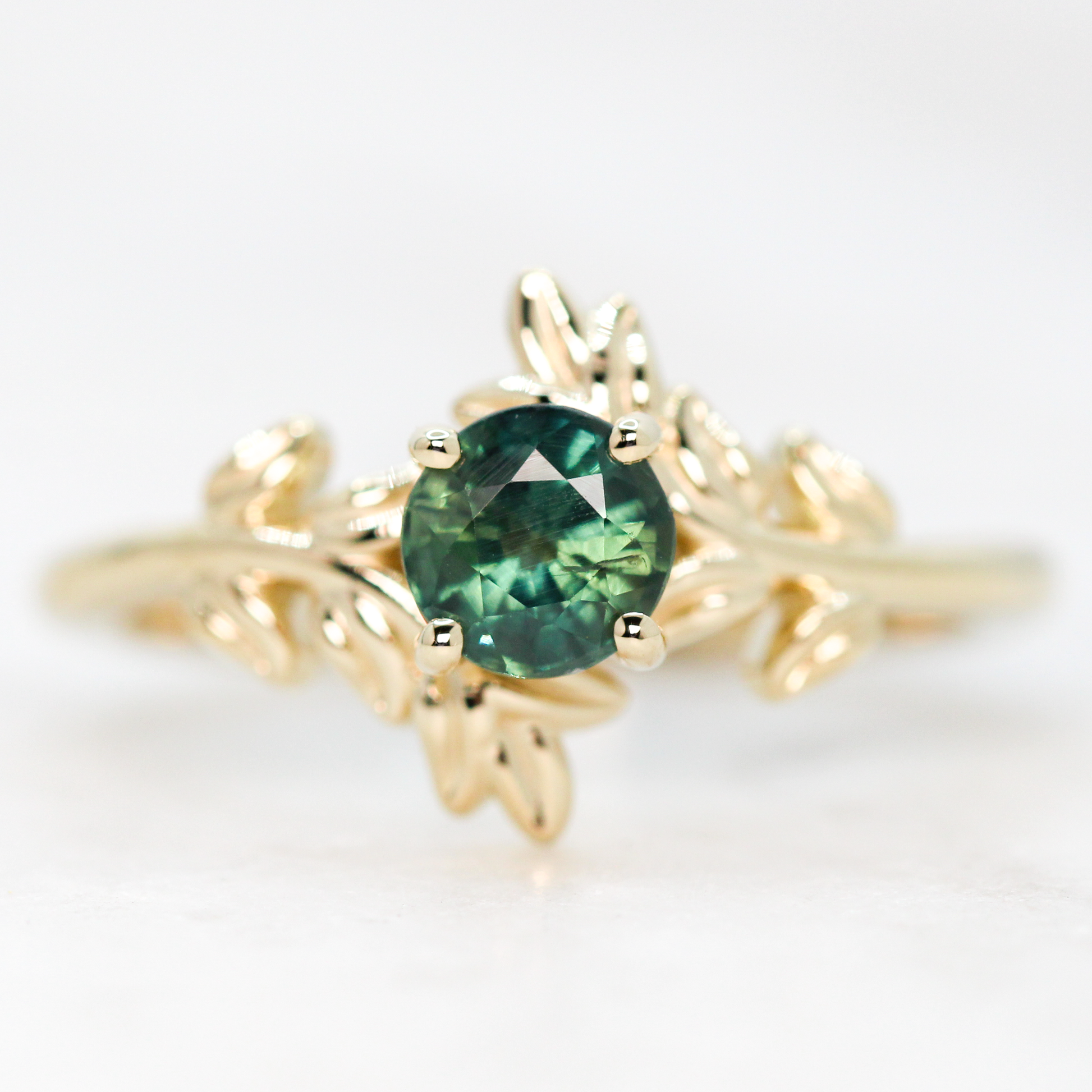 Sara Ring with a 0.94 Carat Round Teal Green Sapphire in 14k Yellow Gold - Ready to Size and Ship - Midwinter Co. Alternative Bridal Rings and Modern Fine Jewelry