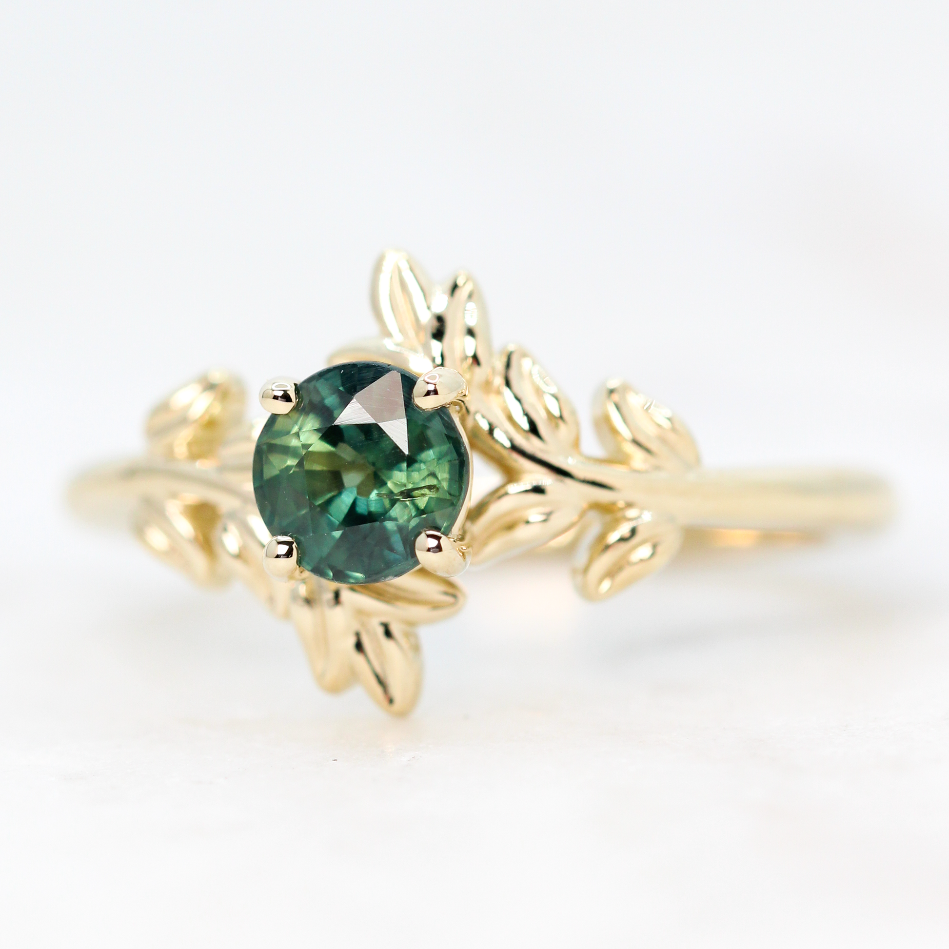 Sara Ring with a 0.94 Carat Round Teal Green Sapphire in 14k Yellow Gold - Ready to Size and Ship - Midwinter Co. Alternative Bridal Rings and Modern Fine Jewelry