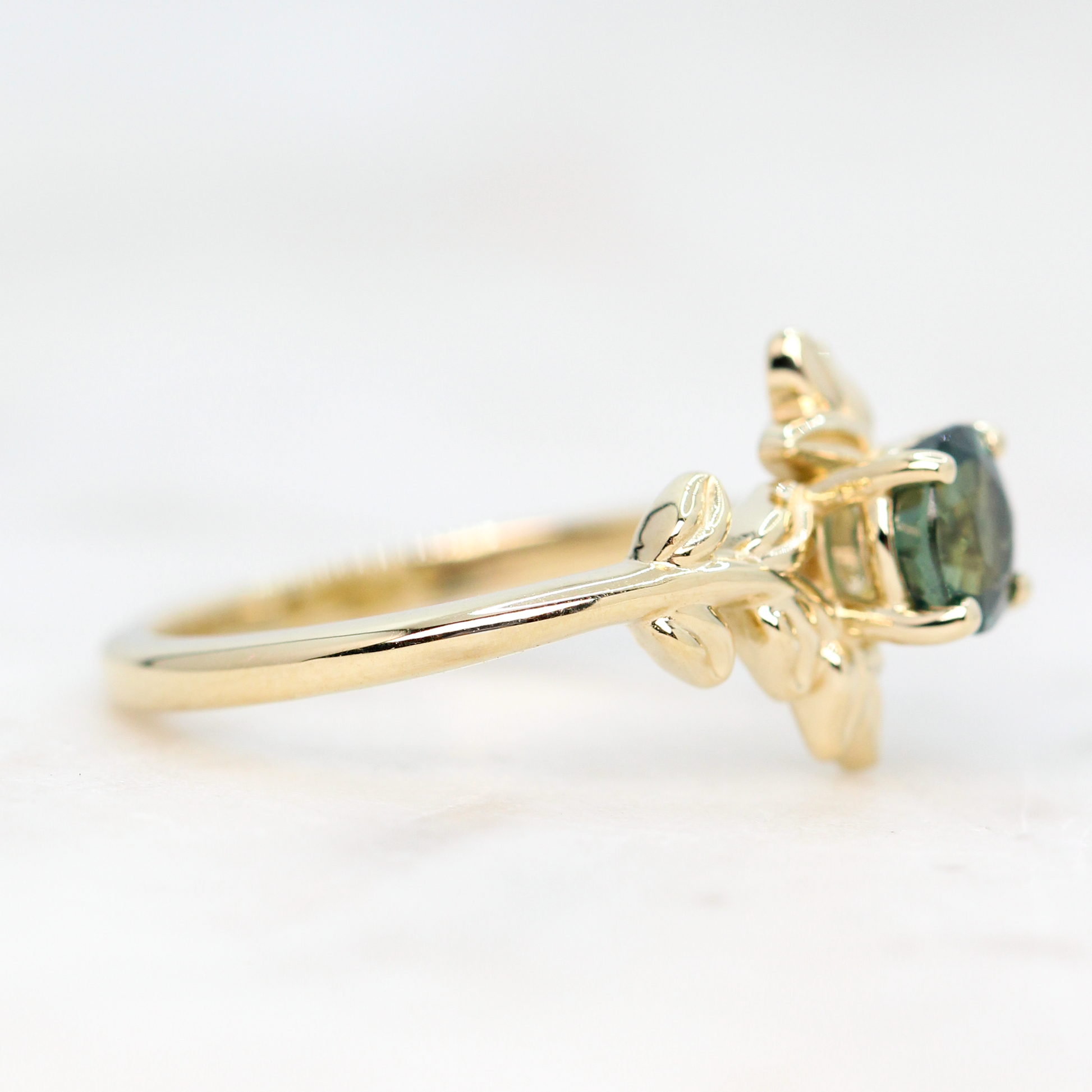 Sara Ring with a 0.94 Carat Round Teal Green Sapphire in 14k Yellow Gold - Ready to Size and Ship - Midwinter Co. Alternative Bridal Rings and Modern Fine Jewelry