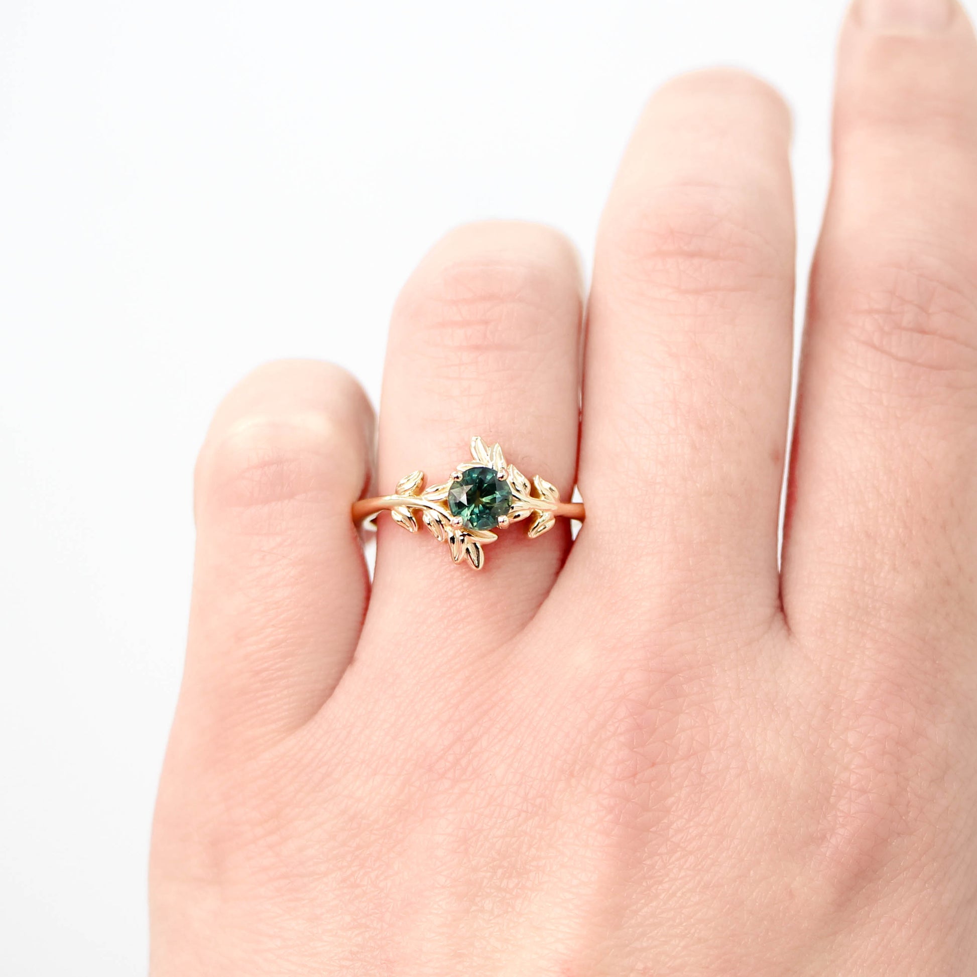 Sara Ring with a 0.94 Carat Round Teal Green Sapphire in 14k Yellow Gold - Ready to Size and Ship - Midwinter Co. Alternative Bridal Rings and Modern Fine Jewelry