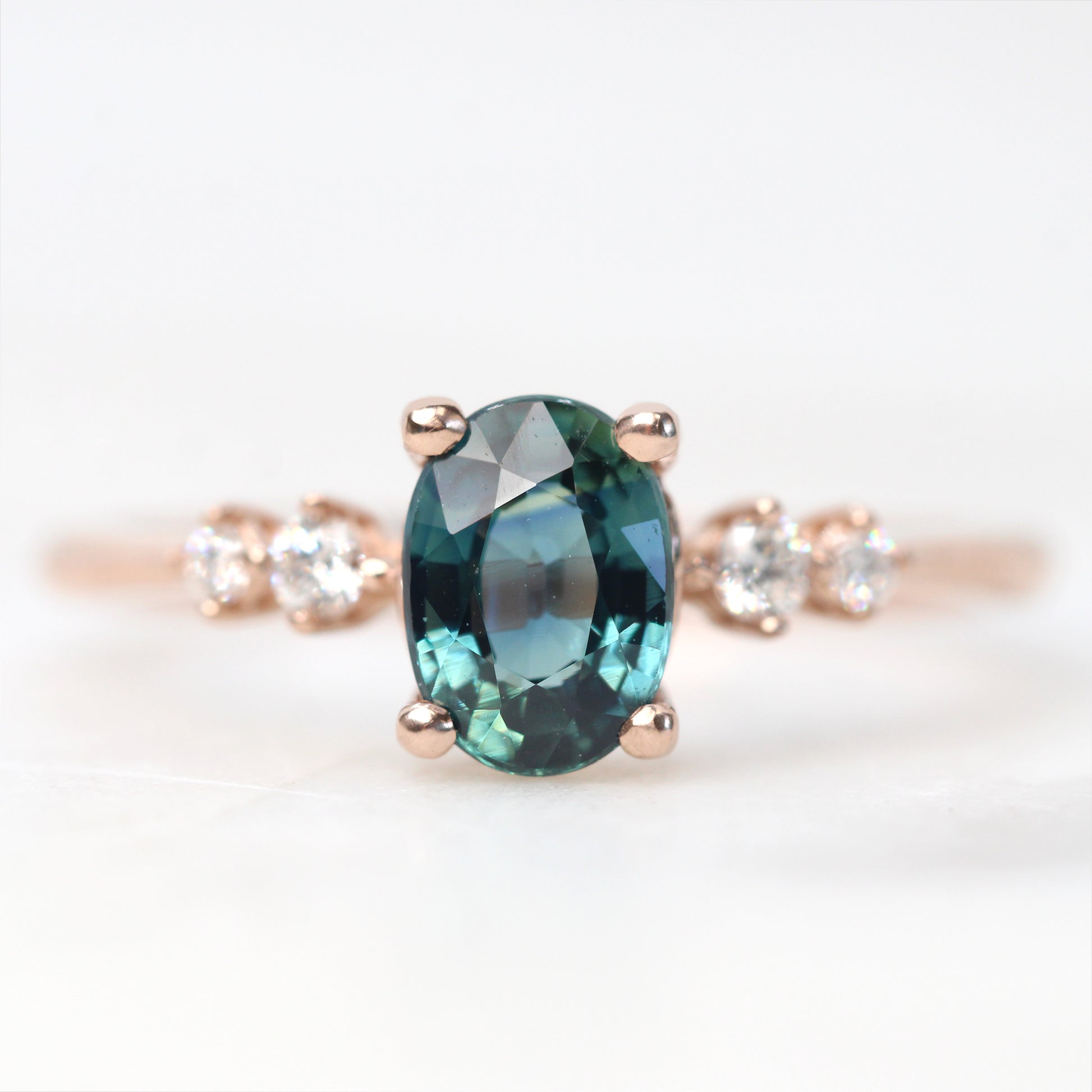 Cordelia Ring with a 1.17 Carat Oval Light Teal Blue Sapphire and White Accent Diamonds in 10k Rose Gold - Ready to Size and Ship - Midwinter Co. Alternative Bridal Rings and Modern Fine Jewelry