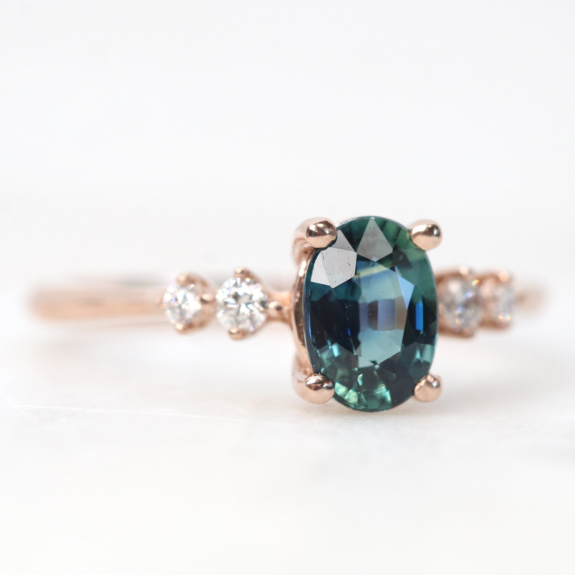 Cordelia Ring with a 1.17 Carat Oval Light Teal Blue Sapphire and White Accent Diamonds in 10k Rose Gold - Ready to Size and Ship - Midwinter Co. Alternative Bridal Rings and Modern Fine Jewelry