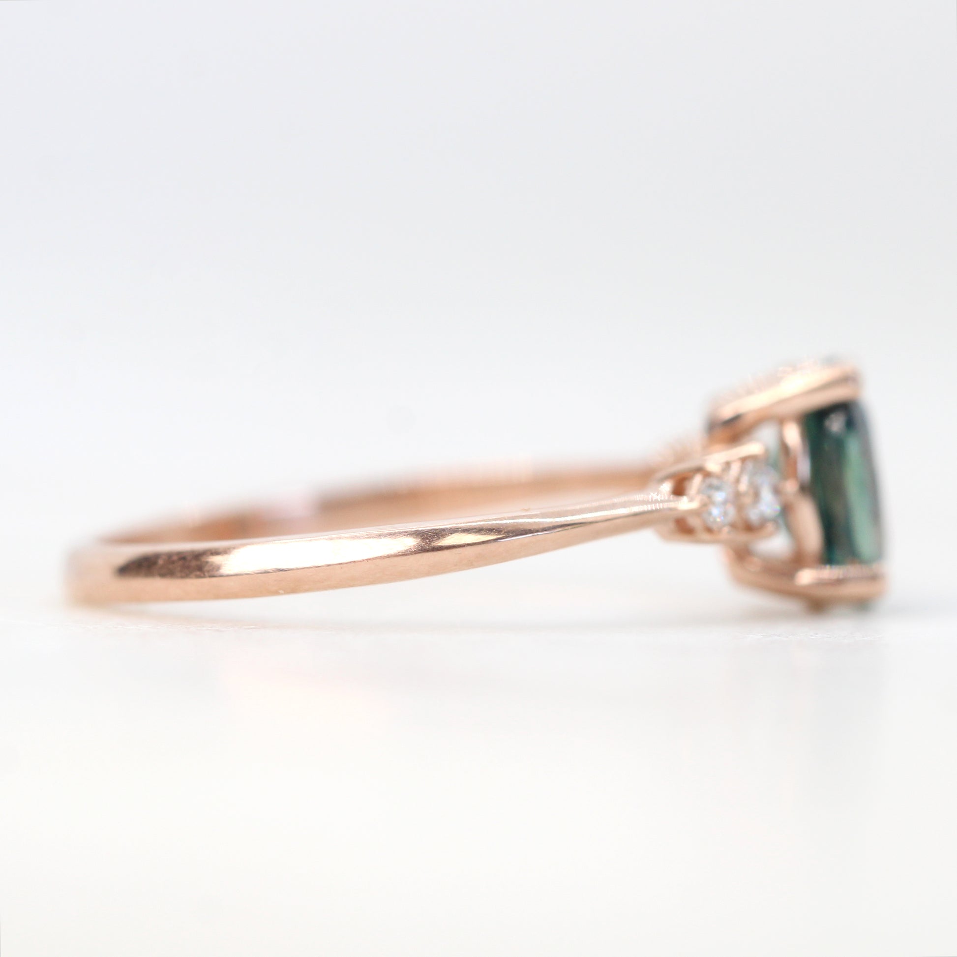 Cordelia Ring with a 1.17 Carat Oval Light Teal Blue Sapphire and White Accent Diamonds in 10k Rose Gold - Ready to Size and Ship - Midwinter Co. Alternative Bridal Rings and Modern Fine Jewelry