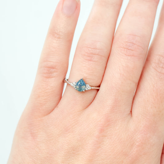 Imogene Ring with a 0.77 Carat Opalescent Blue Pear Sapphire and White Accent Diamonds in 14k White Gold - Ready to Size and Ship