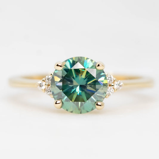 Imogene Ring with a 1.50 Carat Round Teal Moissanite and White Accent Diamonds in 14k Yellow Gold - Ready to Size and Ship