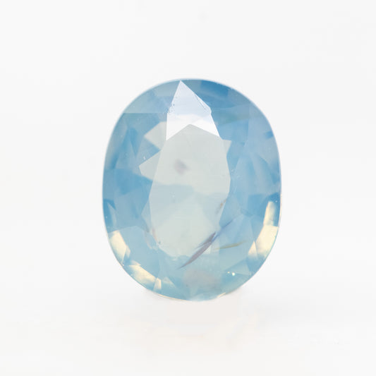 0.85 Carat Opalescent Light Blue Oval Sapphire for Custom Work - Inventory Code LBOS085