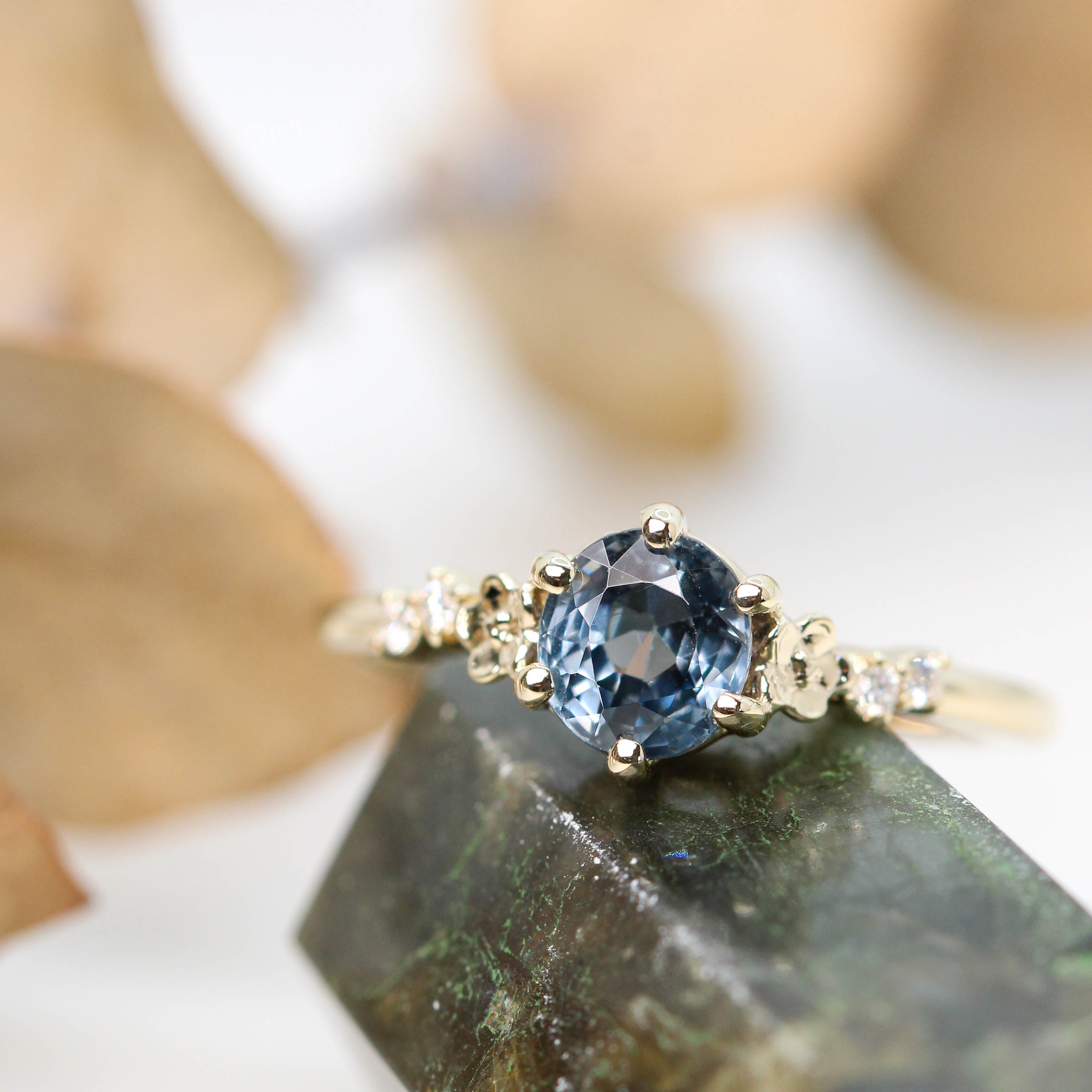 Meadow Ring with a 0.75 Carat Blue Rounded Oval Spinel and White Accent  Diamonds in 14k Yellow Gold - Ready to Size and Ship