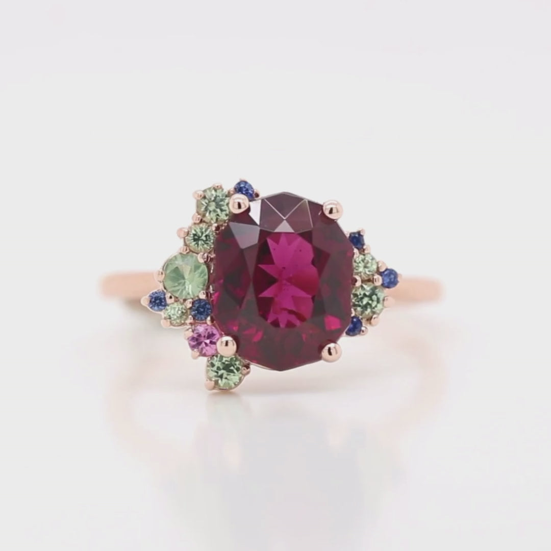 Project: Custom Orion Ring with a 3 Carat Geometric Oval Cut Garnet and Colorful green blue pink Sapphire Accents in 14k