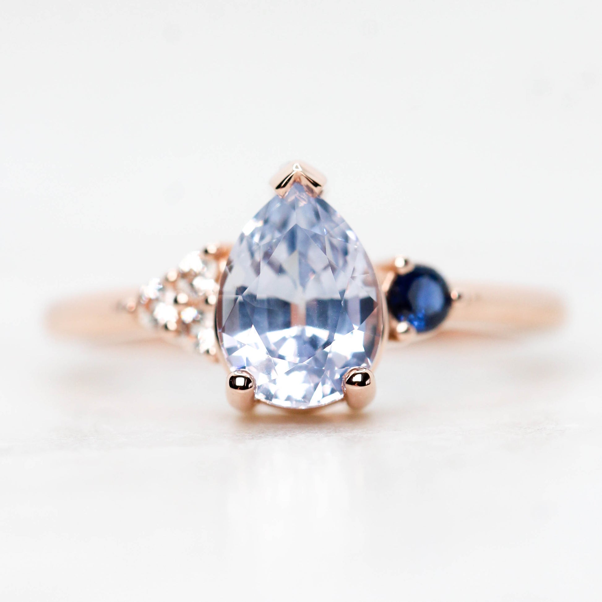 Fletcher Ring with a 1.87 Carat Blue Pear Sapphire and Accent Sapphires in 14k Rose Gold - Ready to Size and Ship - Midwinter Co. Alternative Bridal Rings and Modern Fine Jewelry