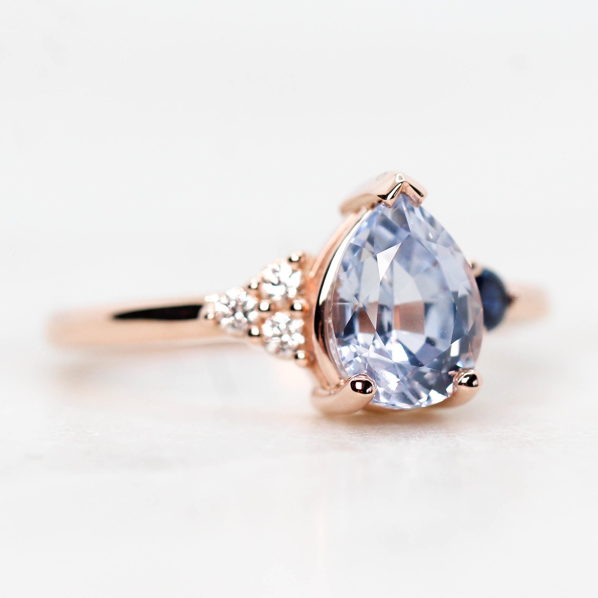 Fletcher Ring with a 1.87 Carat Blue Pear Sapphire and Accent Sapphires in 14k Rose Gold - Ready to Size and Ship - Midwinter Co. Alternative Bridal Rings and Modern Fine Jewelry