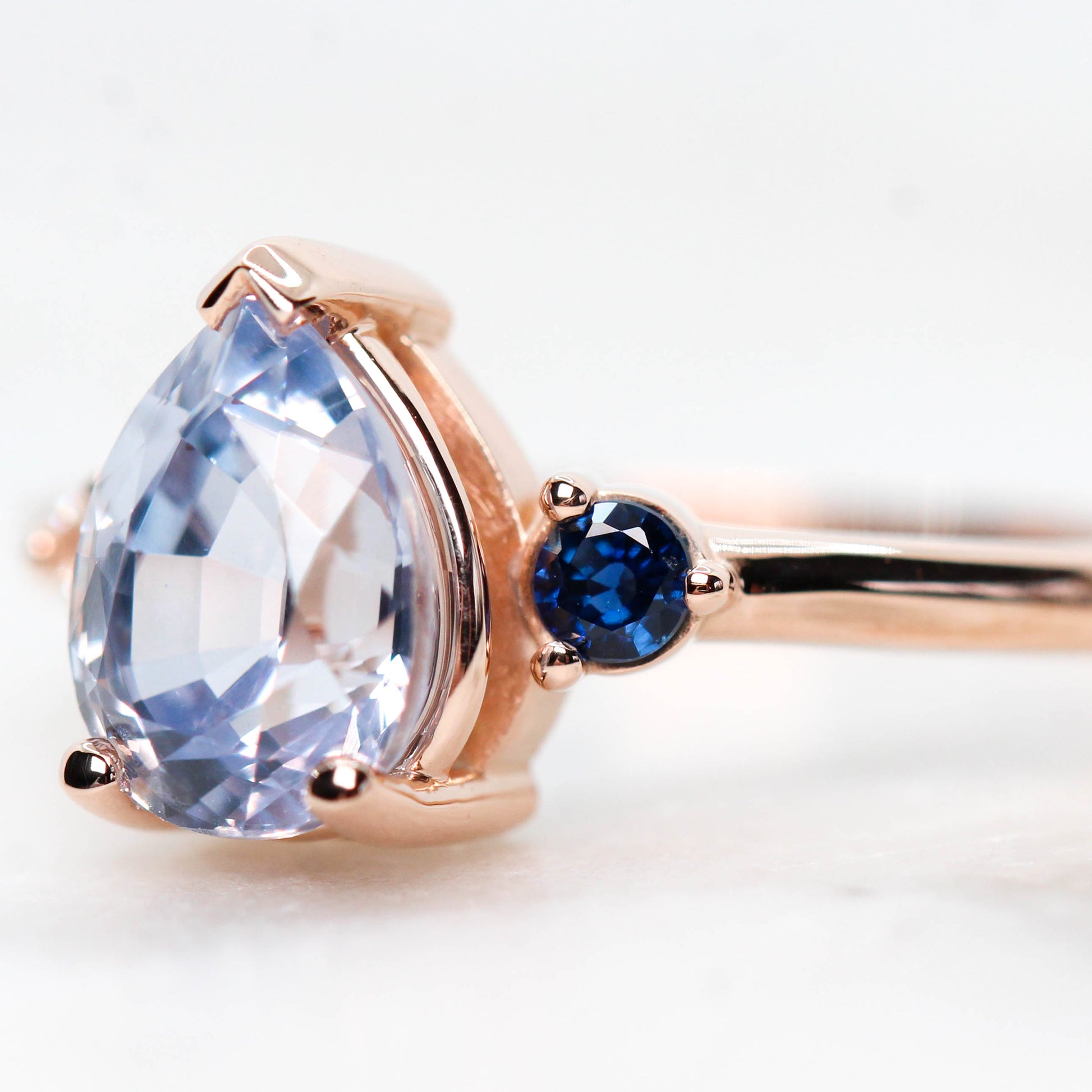 Fletcher Ring with a 1.87 Carat Blue Pear Sapphire and Accent Sapphires in 14k Rose Gold - Ready to Size and Ship - Midwinter Co. Alternative Bridal Rings and Modern Fine Jewelry