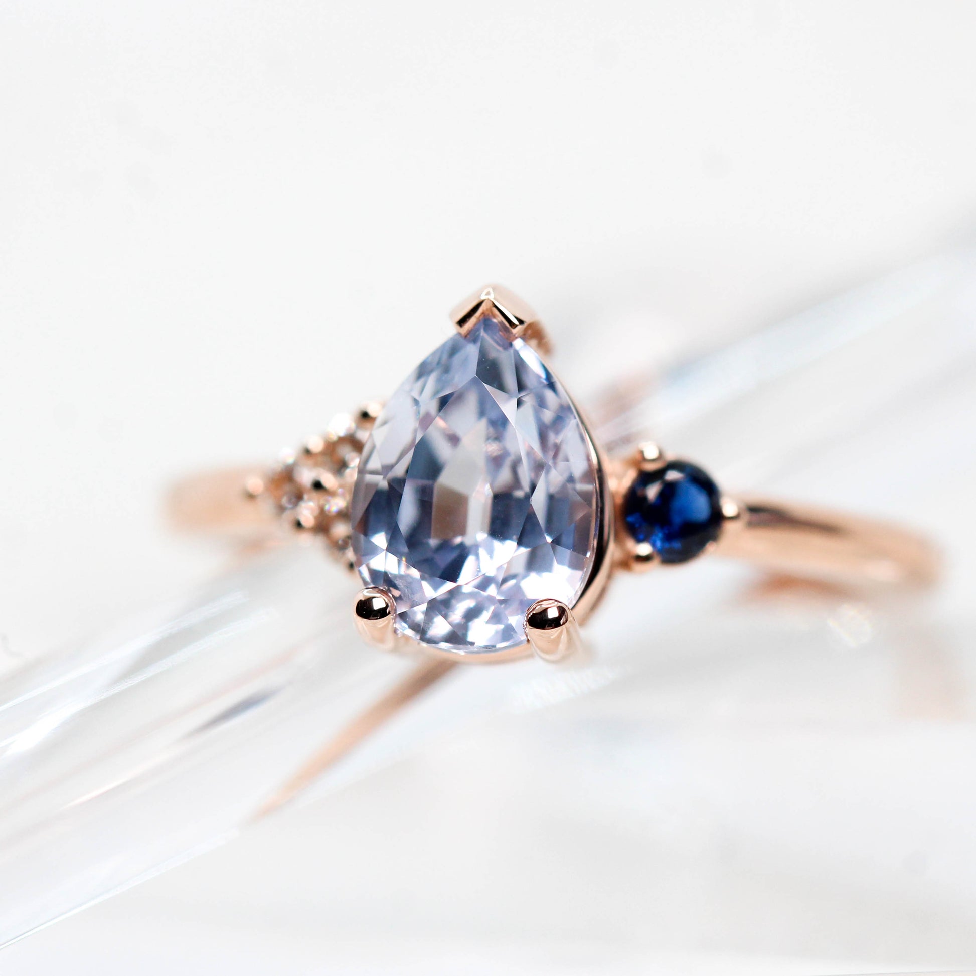 Fletcher Ring with a 1.87 Carat Blue Pear Sapphire and Accent Sapphires in 14k Rose Gold - Ready to Size and Ship - Midwinter Co. Alternative Bridal Rings and Modern Fine Jewelry