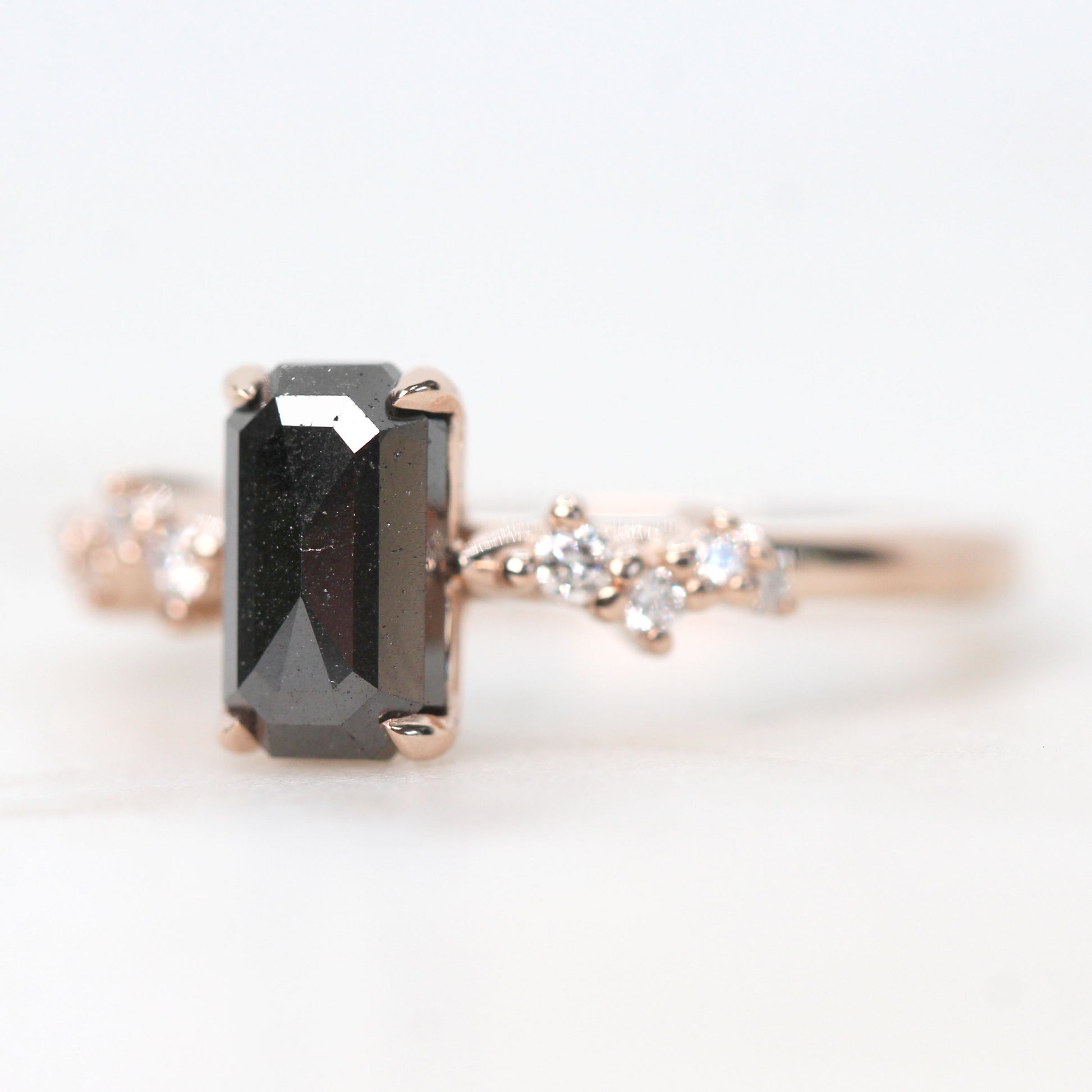 Zealan Ring with a 1.33 Carat Emerald Cut Black Celestial Diamond and White Accent Diamonds in 14k Rose Gold - Ready to Size and Ship - Midwinter Co. Alternative Bridal Rings and Modern Fine Jewelry