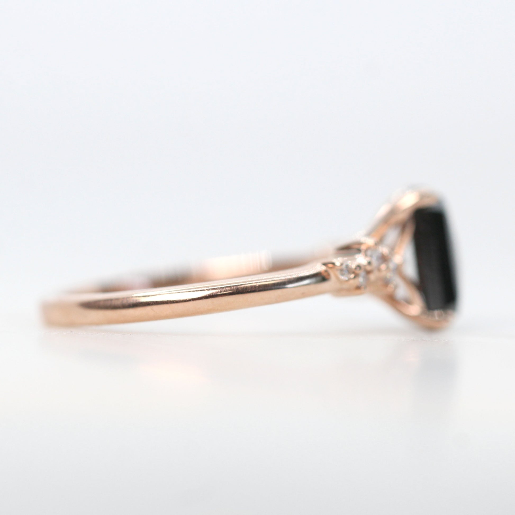 Zealan Ring with a 1.33 Carat Emerald Cut Black Celestial Diamond and White Accent Diamonds in 14k Rose Gold - Ready to Size and Ship - Midwinter Co. Alternative Bridal Rings and Modern Fine Jewelry