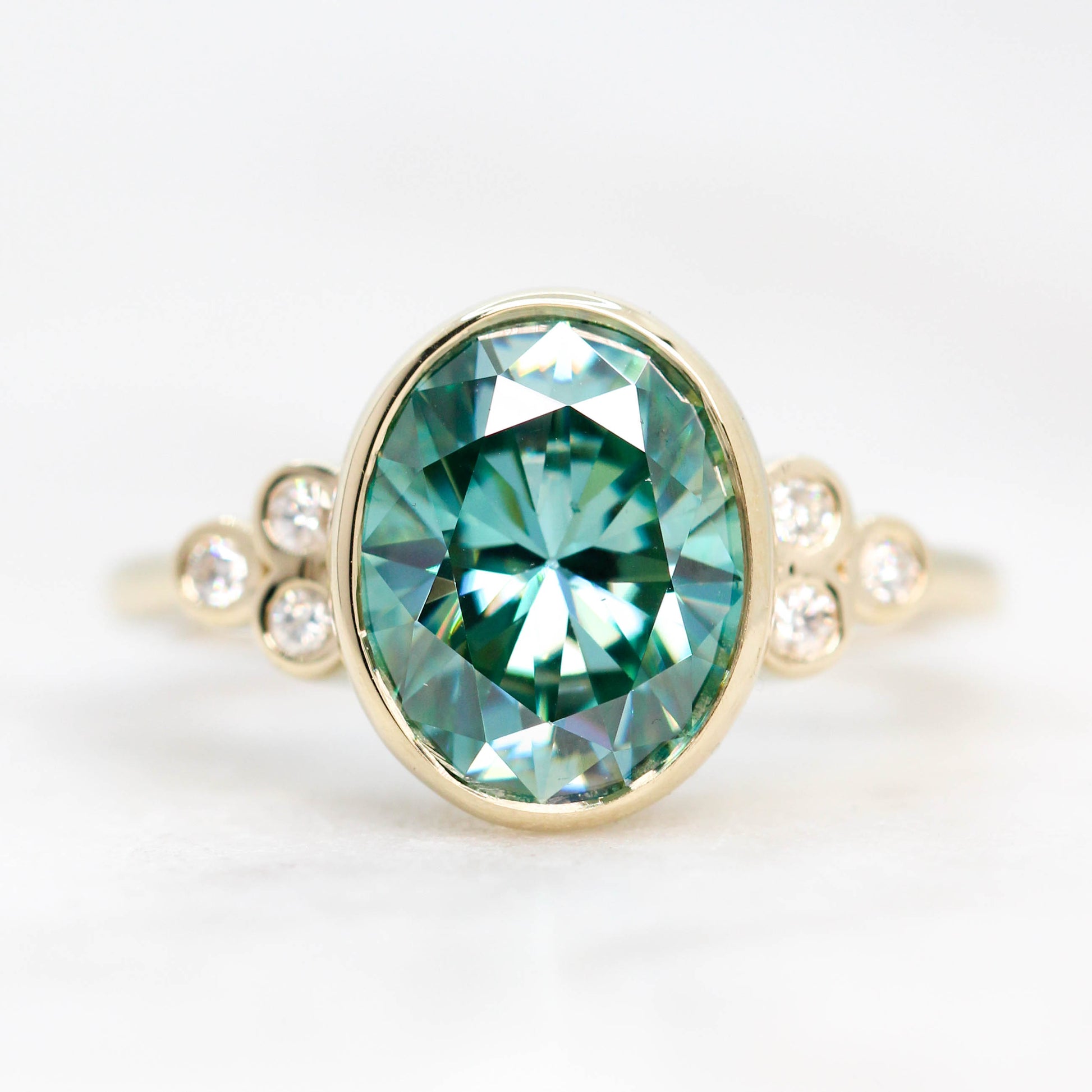 Sophia Ring with a 2.40 Carat Teal Oval Moissanite and Accent Diamonds in 14k Yellow Gold - Ready to Size and Ship - Midwinter Co. Alternative Bridal Rings and Modern Fine Jewelry