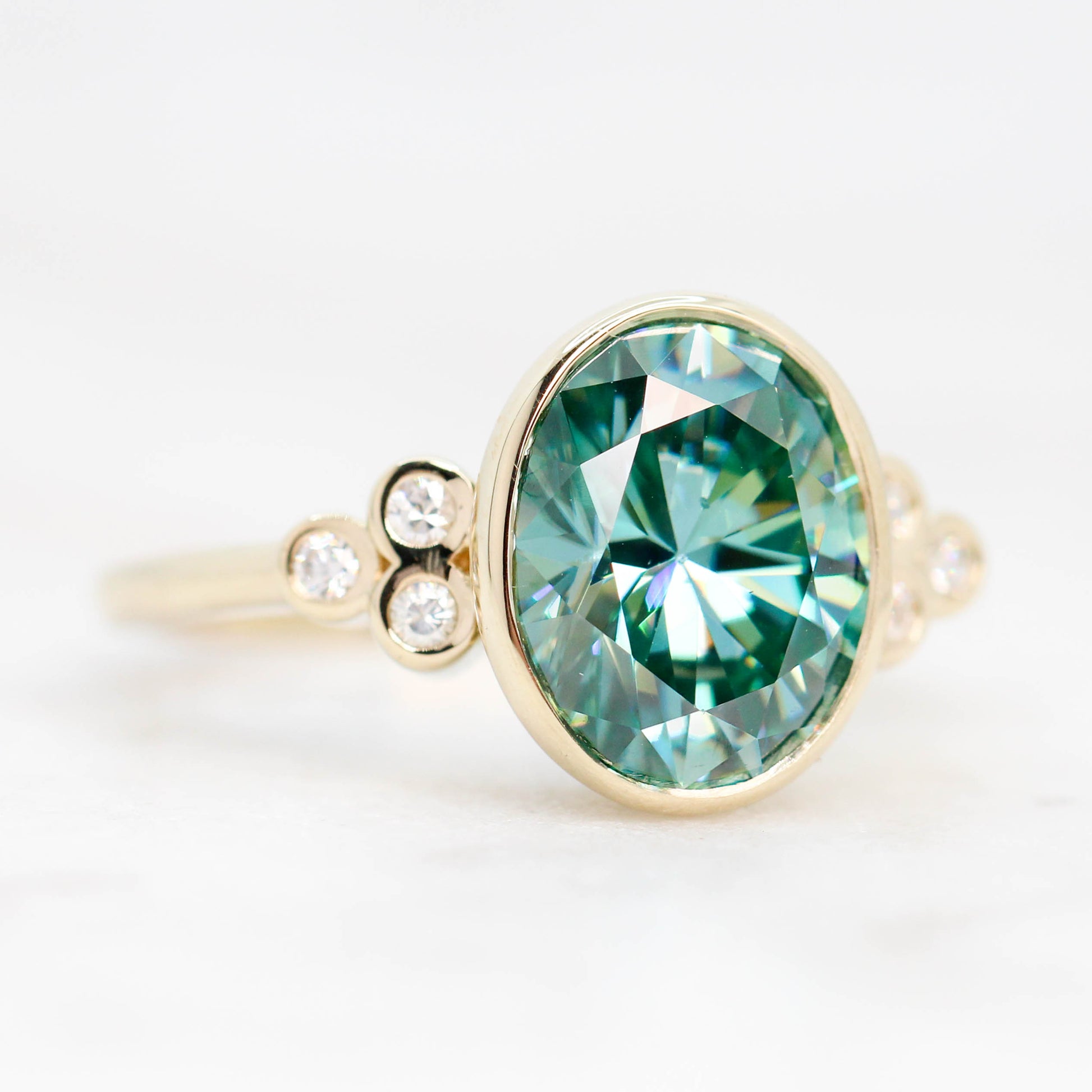 Sophia Ring with a 2.40 Carat Teal Oval Moissanite and Accent Diamonds in 14k Yellow Gold - Ready to Size and Ship - Midwinter Co. Alternative Bridal Rings and Modern Fine Jewelry