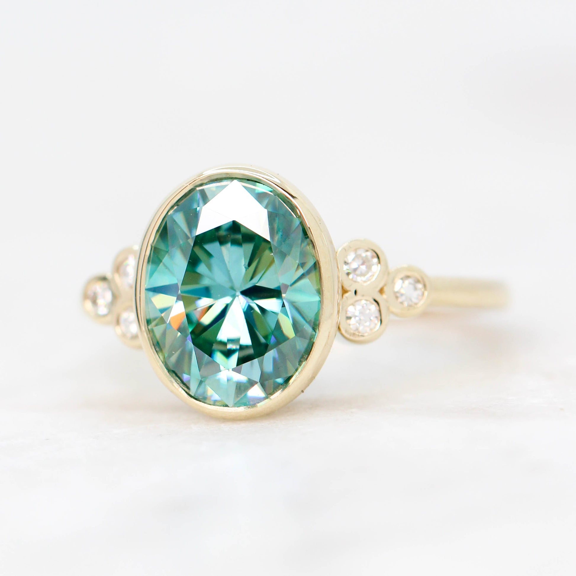 Sophia Ring with a 2.40 Carat Teal Oval Moissanite and Accent Diamonds in 14k Yellow Gold - Ready to Size and Ship - Midwinter Co. Alternative Bridal Rings and Modern Fine Jewelry