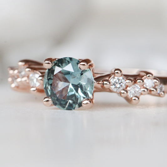 Zealan Ring with a 0.63 Carat Round Teal Sapphire and White Accent Diamonds in 10K Rose Gold - Ready to Size and Ship - Midwinter Co. Alternative Bridal Rings and Modern Fine Jewelry