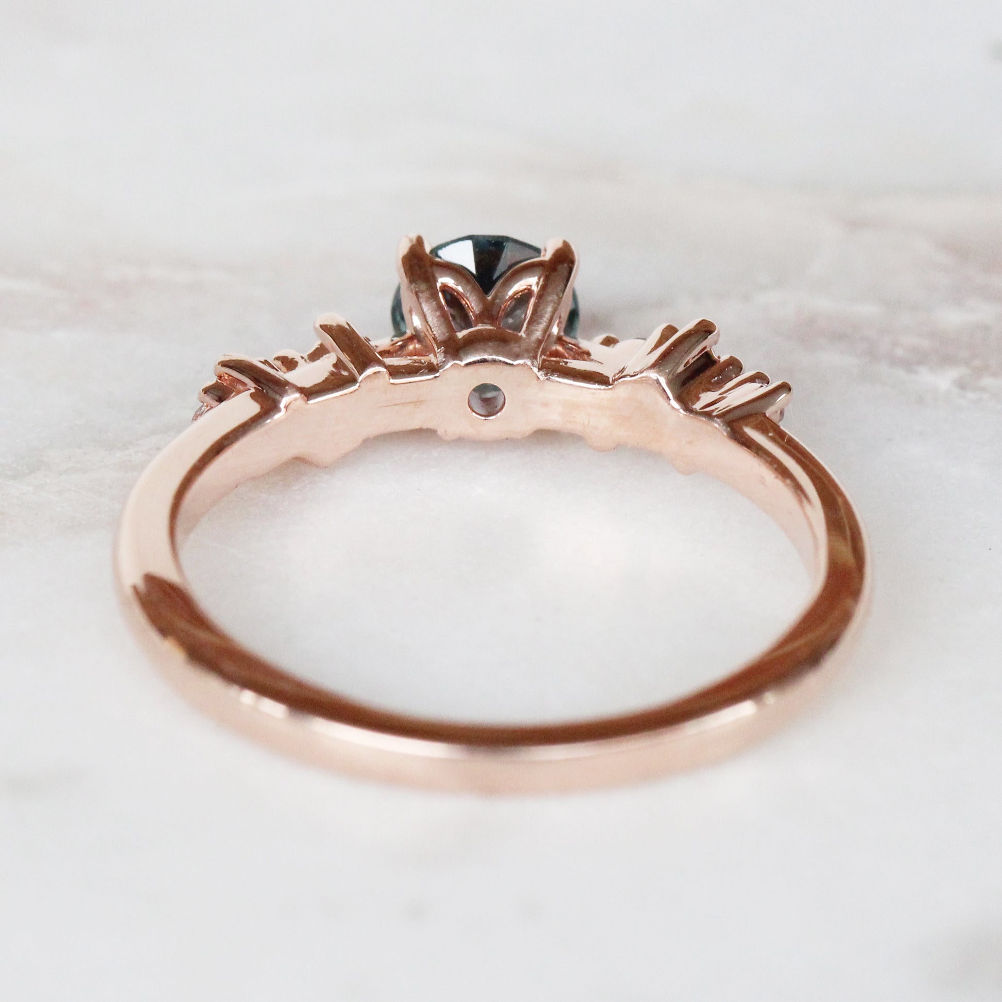 Zealan Ring with a 0.63 Carat Round Teal Sapphire and White Accent Diamonds in 10K Rose Gold - Ready to Size and Ship - Midwinter Co. Alternative Bridal Rings and Modern Fine Jewelry