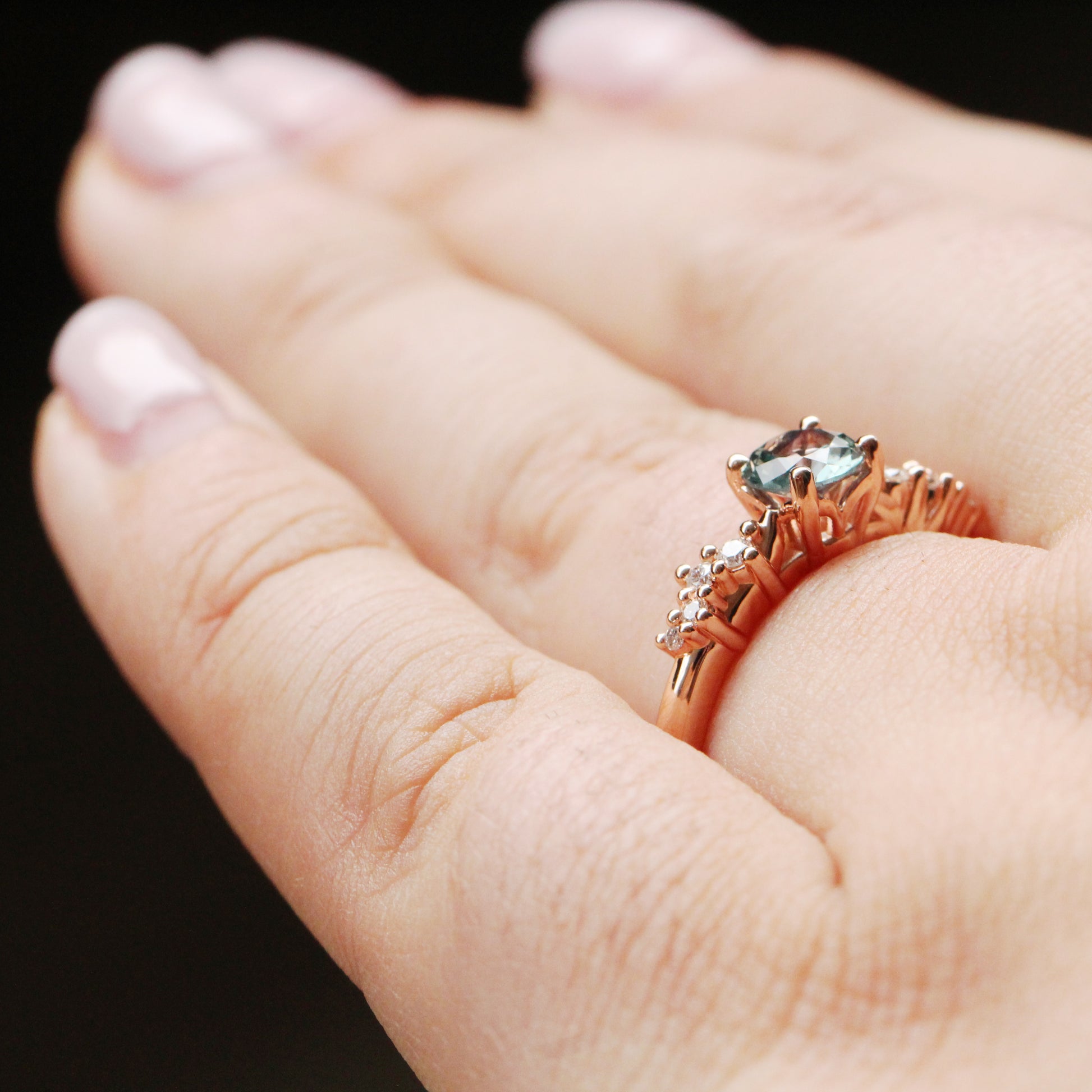 Zealan Ring with a 0.63 Carat Round Teal Sapphire and White Accent Diamonds in 10K Rose Gold - Ready to Size and Ship - Midwinter Co. Alternative Bridal Rings and Modern Fine Jewelry