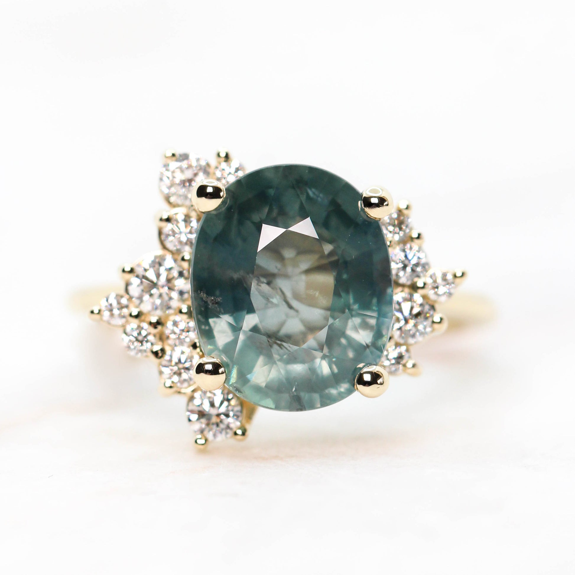 Orion Ring with a 6.00 Carat Teal Blue Oval Sapphire and White Accent Diamonds in 14k Yellow Gold - Ready to Size and Ship - Midwinter Co. Alternative Bridal Rings and Modern Fine Jewelry