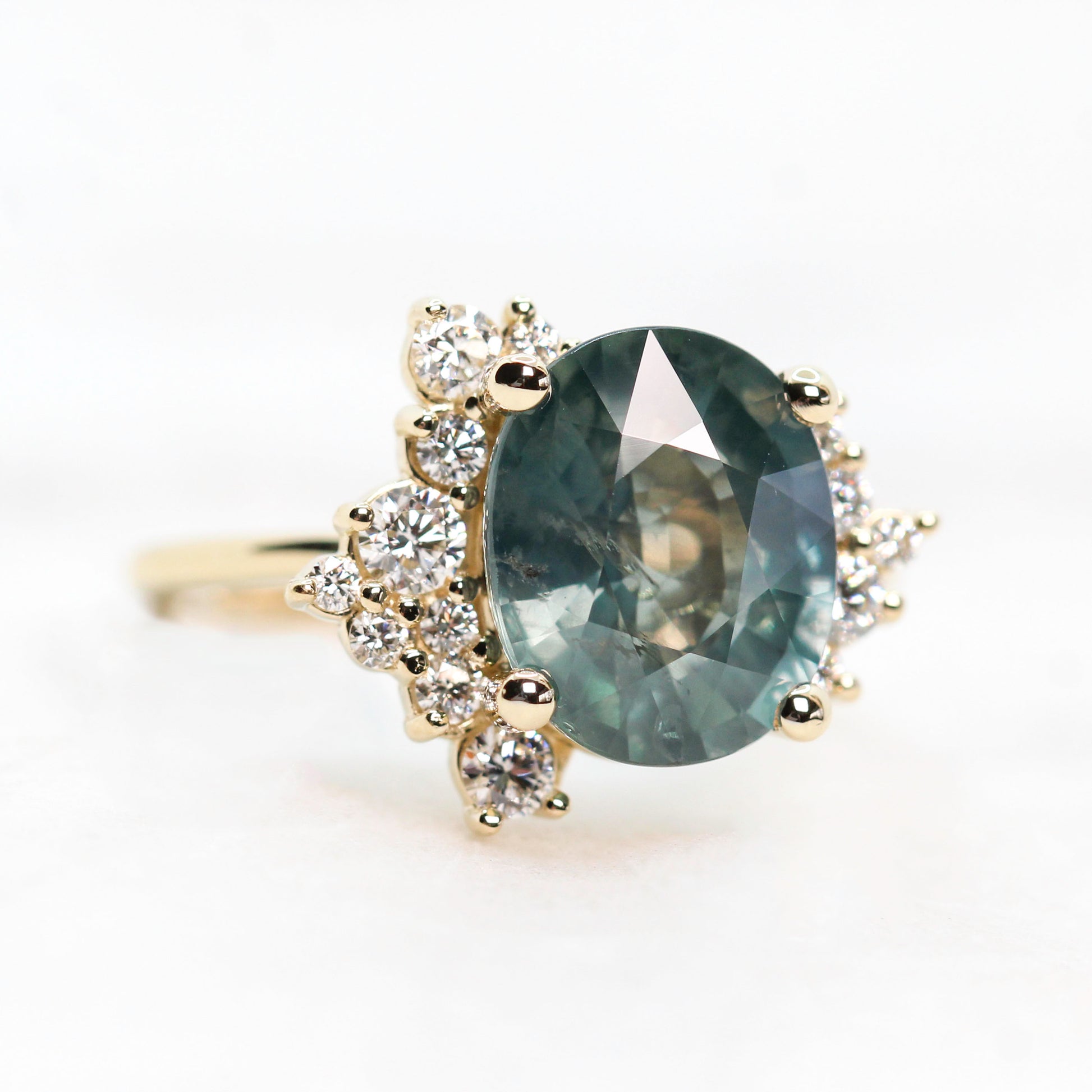 Orion Ring with a 6.00 Carat Teal Blue Oval Sapphire and White Accent Diamonds in 14k Yellow Gold - Ready to Size and Ship - Midwinter Co. Alternative Bridal Rings and Modern Fine Jewelry