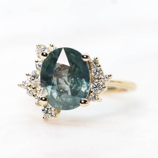 Orion Ring with a 6.00 Carat Teal Blue Oval Sapphire and White Accent Diamonds in 14k Yellow Gold - Ready to Size and Ship - Midwinter Co. Alternative Bridal Rings and Modern Fine Jewelry