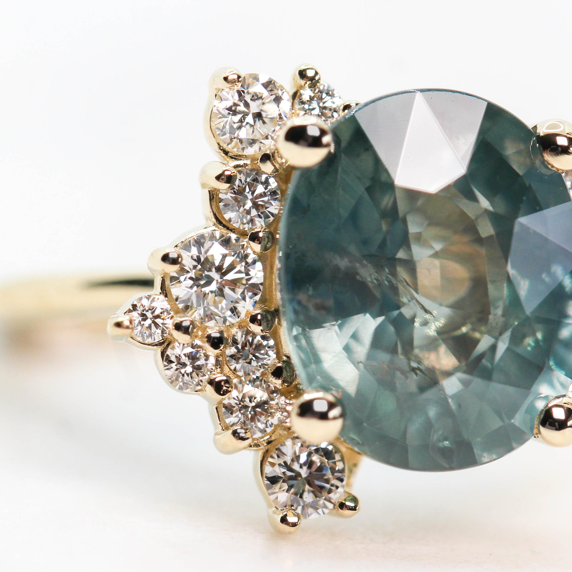 Orion Ring with a 6.00 Carat Teal Blue Oval Sapphire and White Accent Diamonds in 14k Yellow Gold - Ready to Size and Ship - Midwinter Co. Alternative Bridal Rings and Modern Fine Jewelry