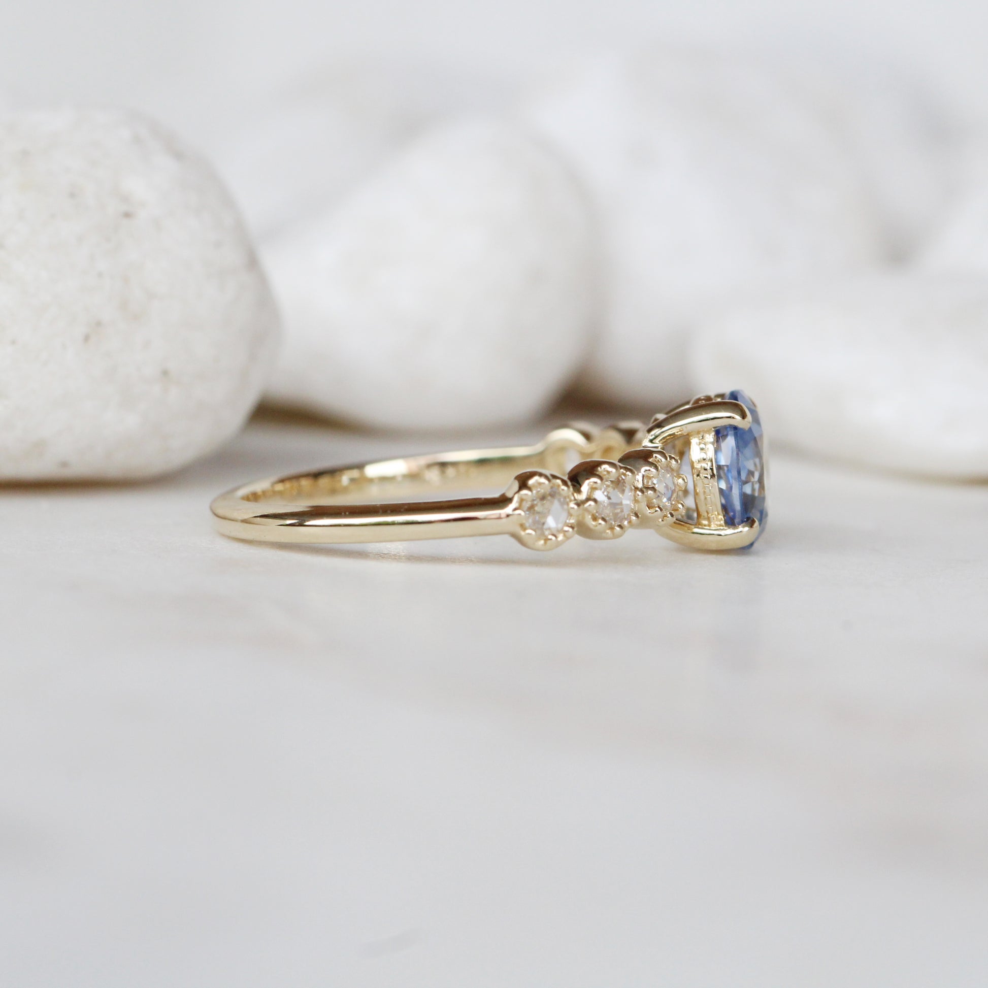 Rudy Ring with a 1.48 Carat Round Light Blue Sapphire and White Rose Cut Diamond Accents in 14K Yellow Gold - Ready to Size and Ship - Midwinter Co. Alternative Bridal Rings and Modern Fine Jewelry