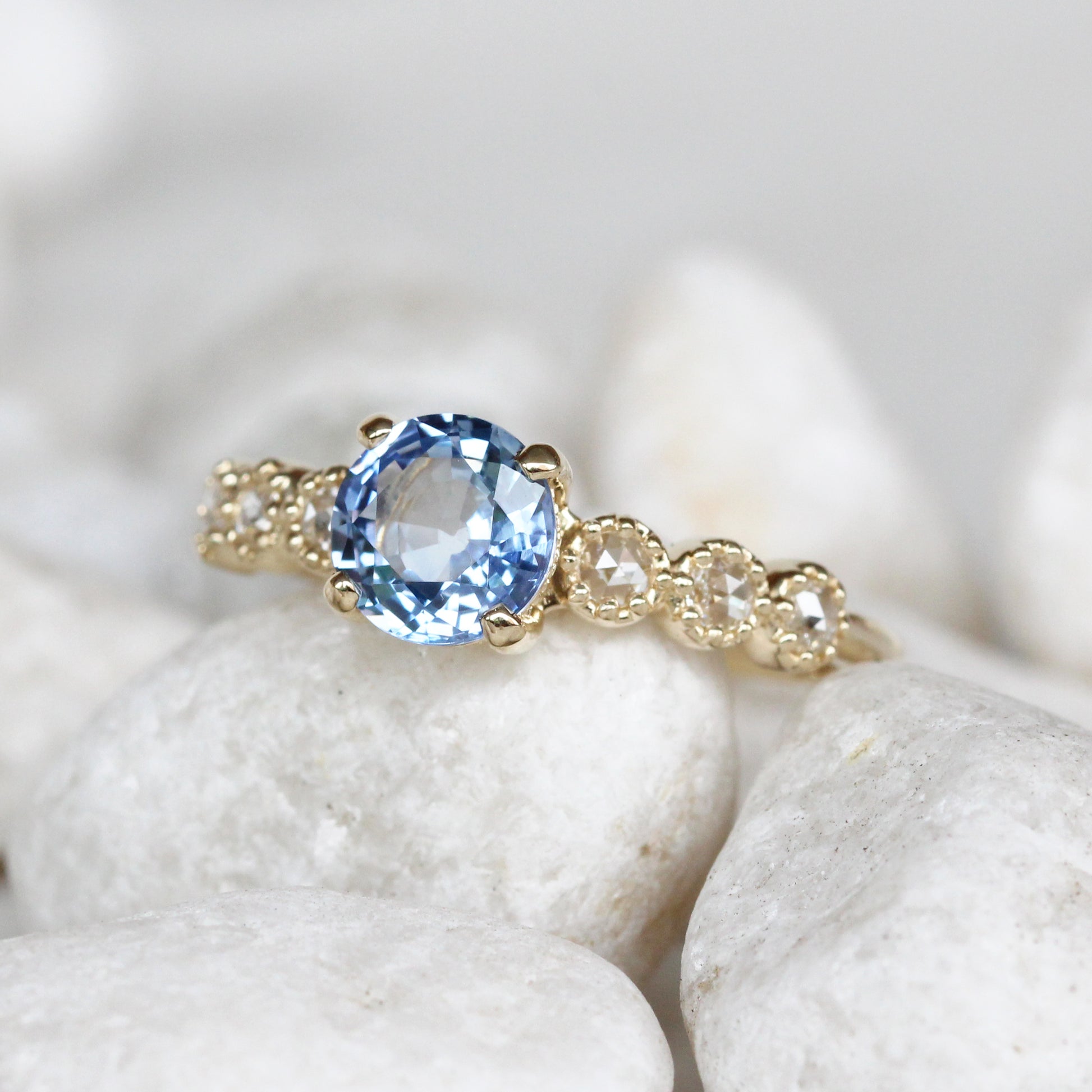 Rudy Ring with a 1.48 Carat Round Light Blue Sapphire and White Rose Cut Diamond Accents in 14K Yellow Gold - Ready to Size and Ship - Midwinter Co. Alternative Bridal Rings and Modern Fine Jewelry