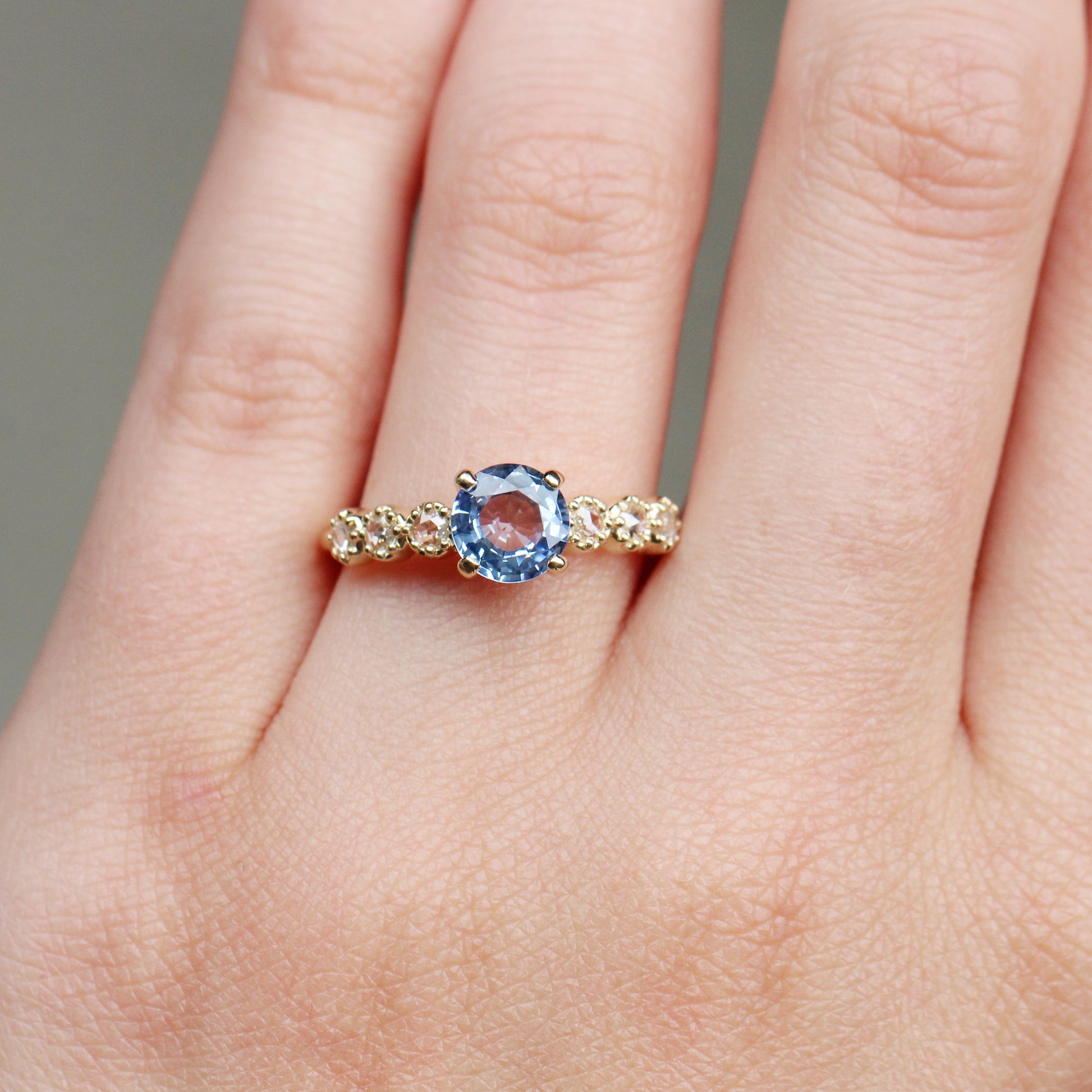 Rudy Ring with a 1.48 Carat Round Light Blue Sapphire and White Rose Cut Diamond Accents in 14K Yellow Gold - Ready to Size and Ship - Midwinter Co. Alternative Bridal Rings and Modern Fine Jewelry