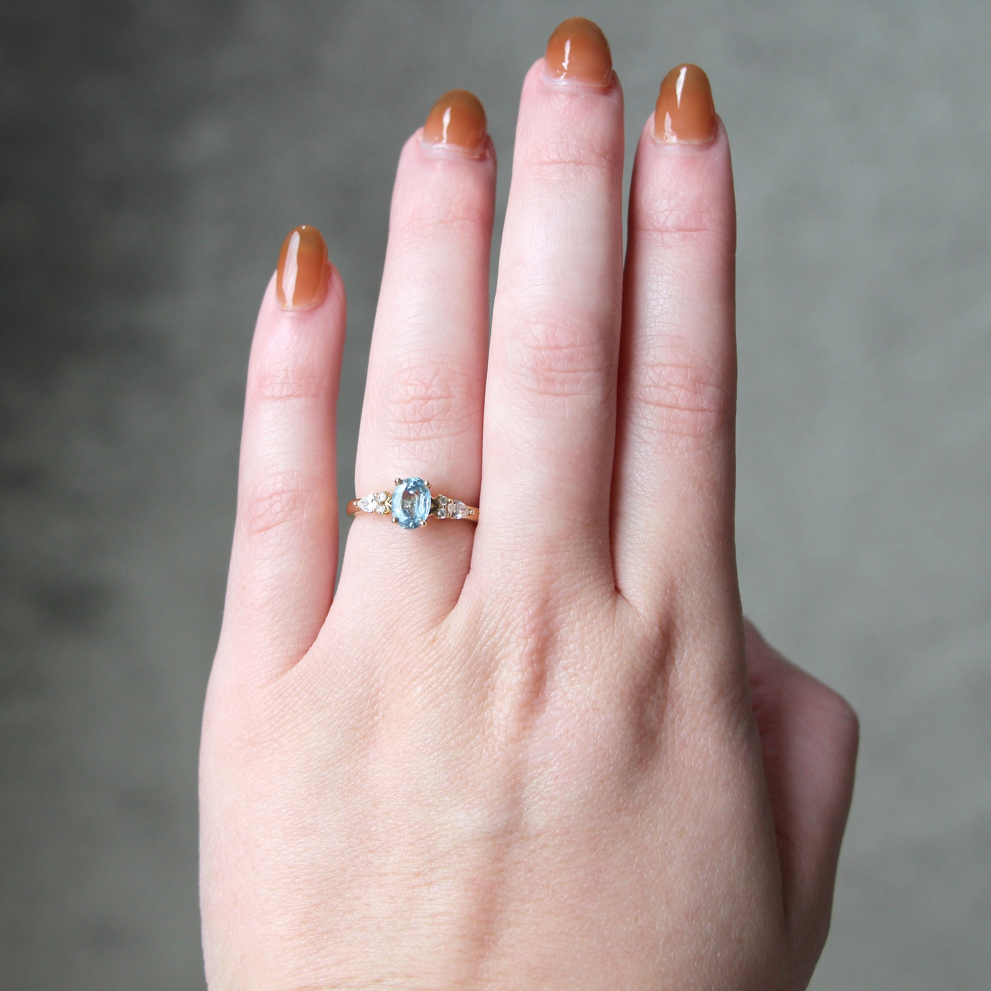 Jenna Ring with a 0.93 Carat Light Blue Oval Sapphire and White Accent Diamonds in 14k Yellow Gold - Ready to Size and Ship - Midwinter Co. Alternative Bridal Rings and Modern Fine Jewelry