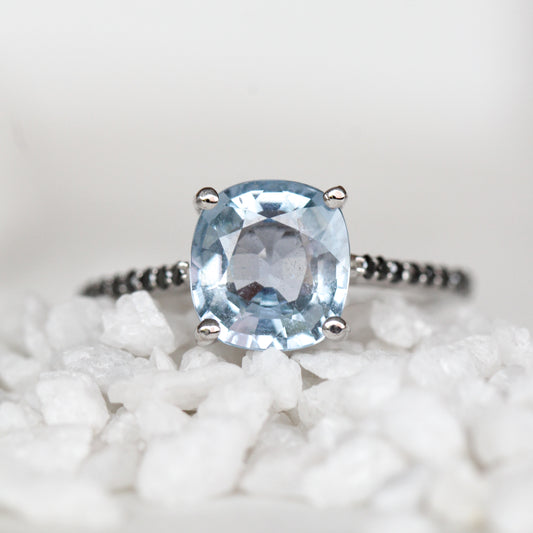 Raine Ring with a 3.18 Carat Light Blue Cushion Cut Sapphire and Black Accent Diamonds in 14k White Gold - Ready to Size and Ship - Midwinter Co. Alternative Bridal Rings and Modern Fine Jewelry