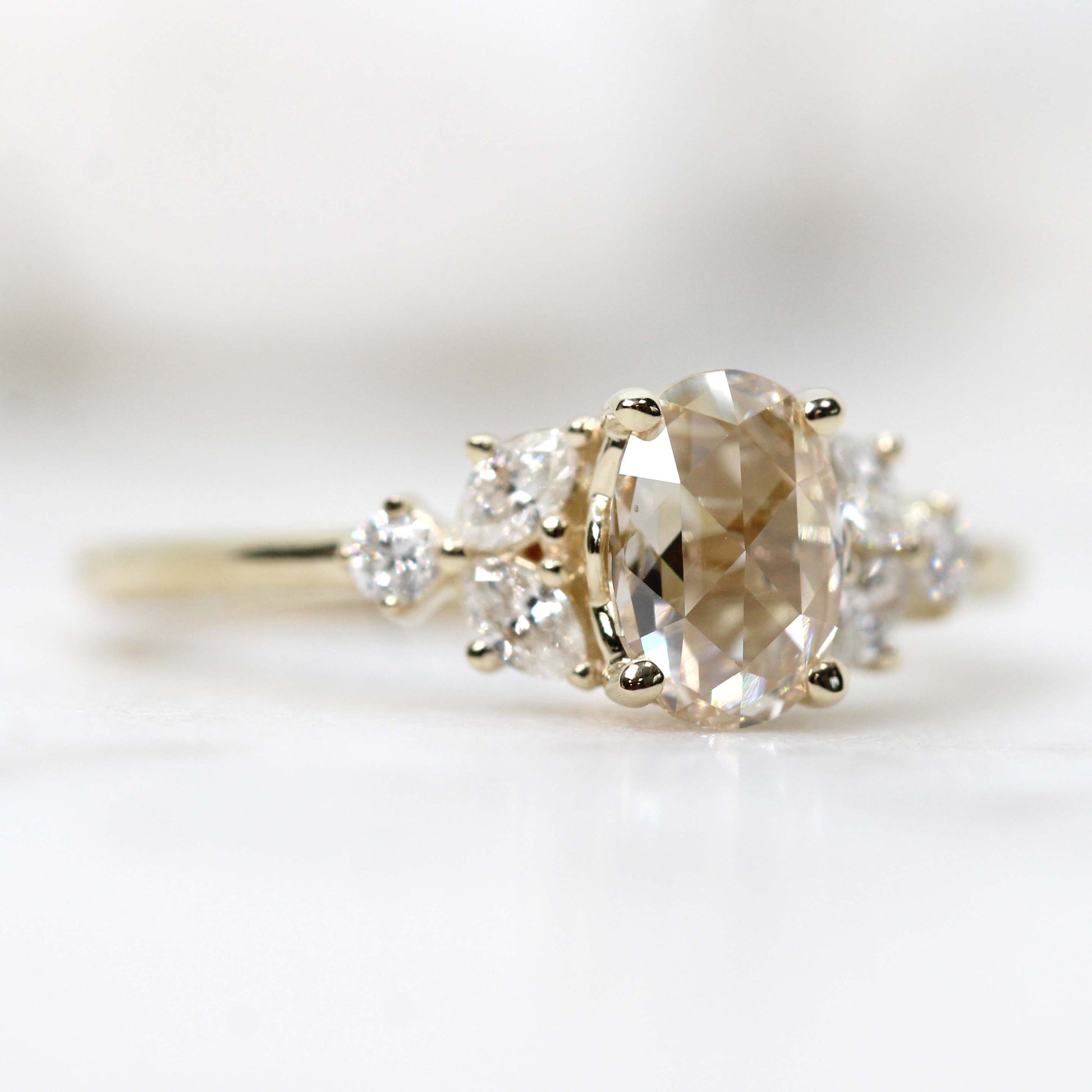 Andia Ring with a 0.73 Carat Clear Oval Celestial Diamond and White Accent Diamonds in 14k Yellow Gold - Ready to Size and Ship - Midwinter Co. Alternative Bridal Rings and Modern Fine Jewelry