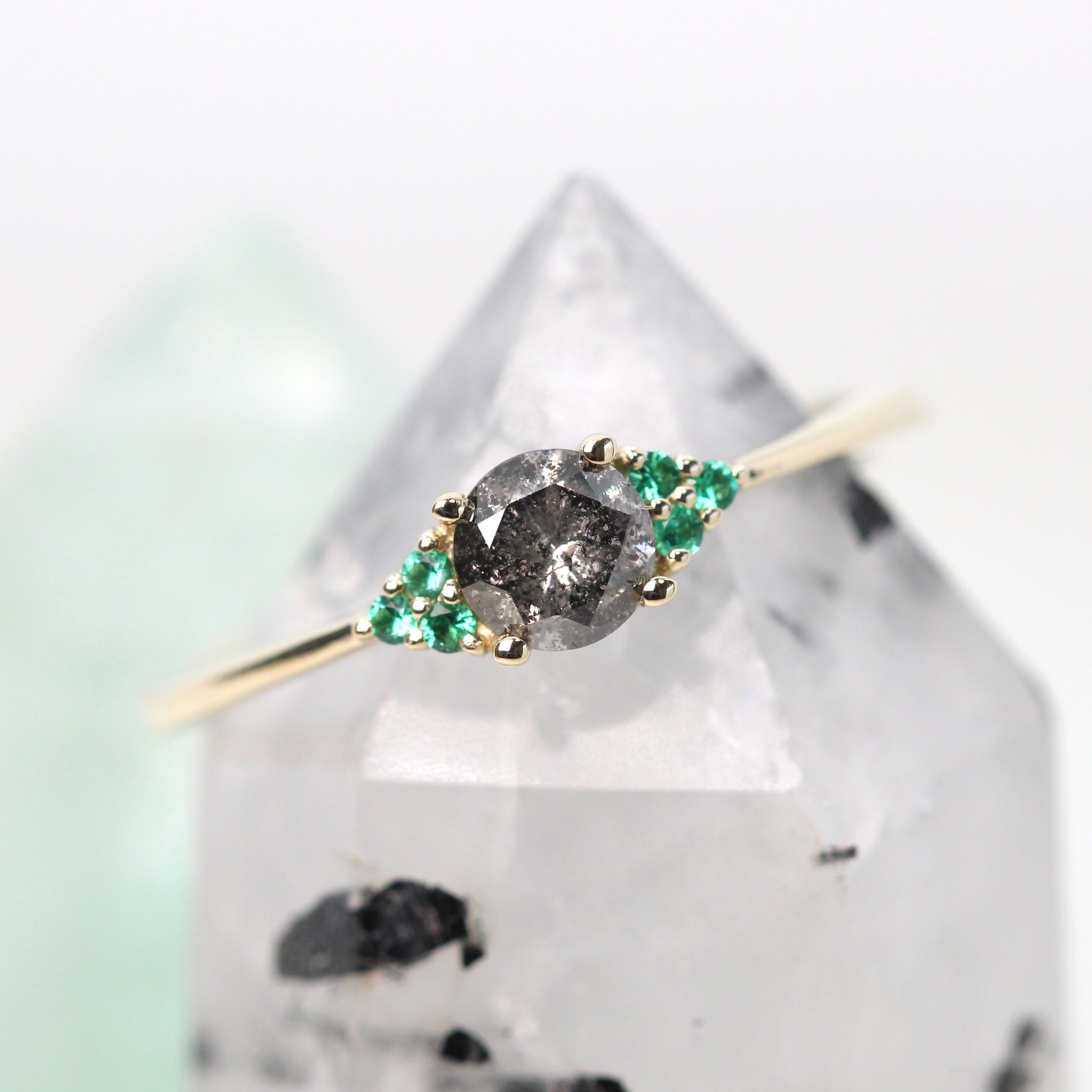 Imogene Ring with a 0.46 Carat Round Dark Gray Celestial Diamond and Emerald Accents in 14k Yellow Gold - Ready to Size and Ship - Midwinter Co. Alternative Bridal Rings and Modern Fine Jewelry