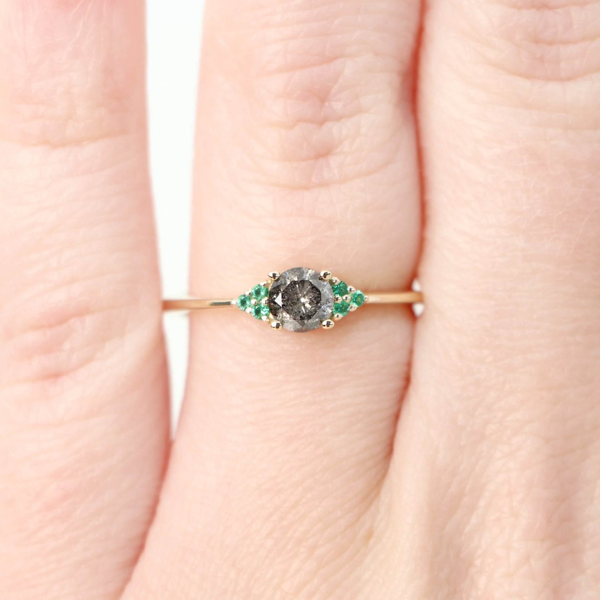 Imogene Ring with a 0.46 Carat Round Dark Gray Celestial Diamond and Emerald Accents in 14k Yellow Gold - Ready to Size and Ship - Midwinter Co. Alternative Bridal Rings and Modern Fine Jewelry