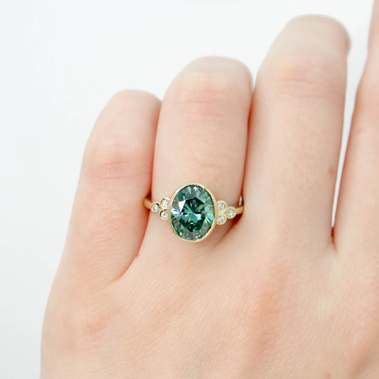 Sophia Ring with a 2.40 Carat Teal Oval Moissanite and Accent Diamonds in 14k Yellow Gold - Ready to Size and Ship - Midwinter Co. Alternative Bridal Rings and Modern Fine Jewelry