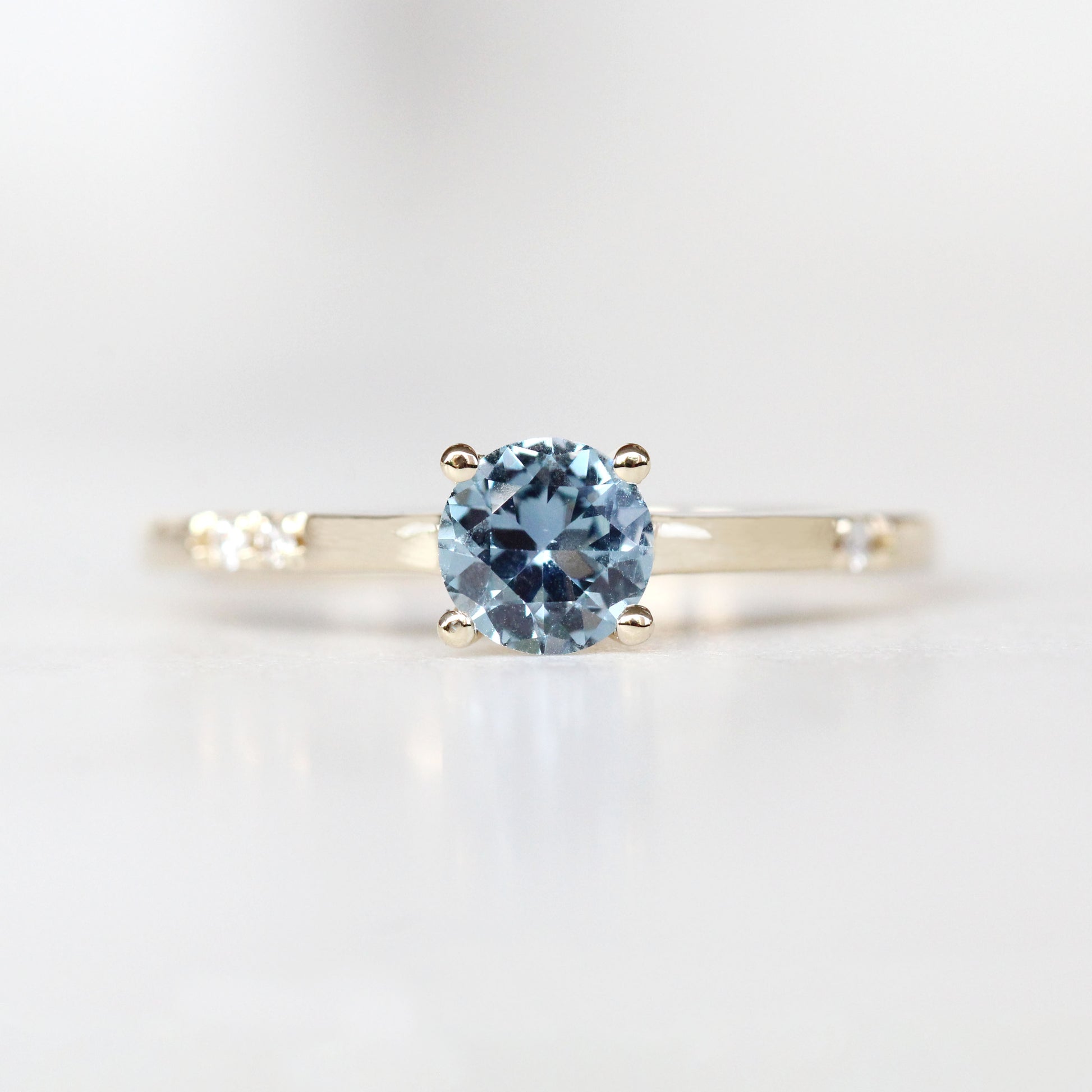 Xavier Ring with a 0.69 Carat Blue Sapphire and Three Asymmetrical White Diamond Accents in 14k Yellow Gold - Ready to Size and Ship - Midwinter Co. Alternative Bridal Rings and Modern Fine Jewelry