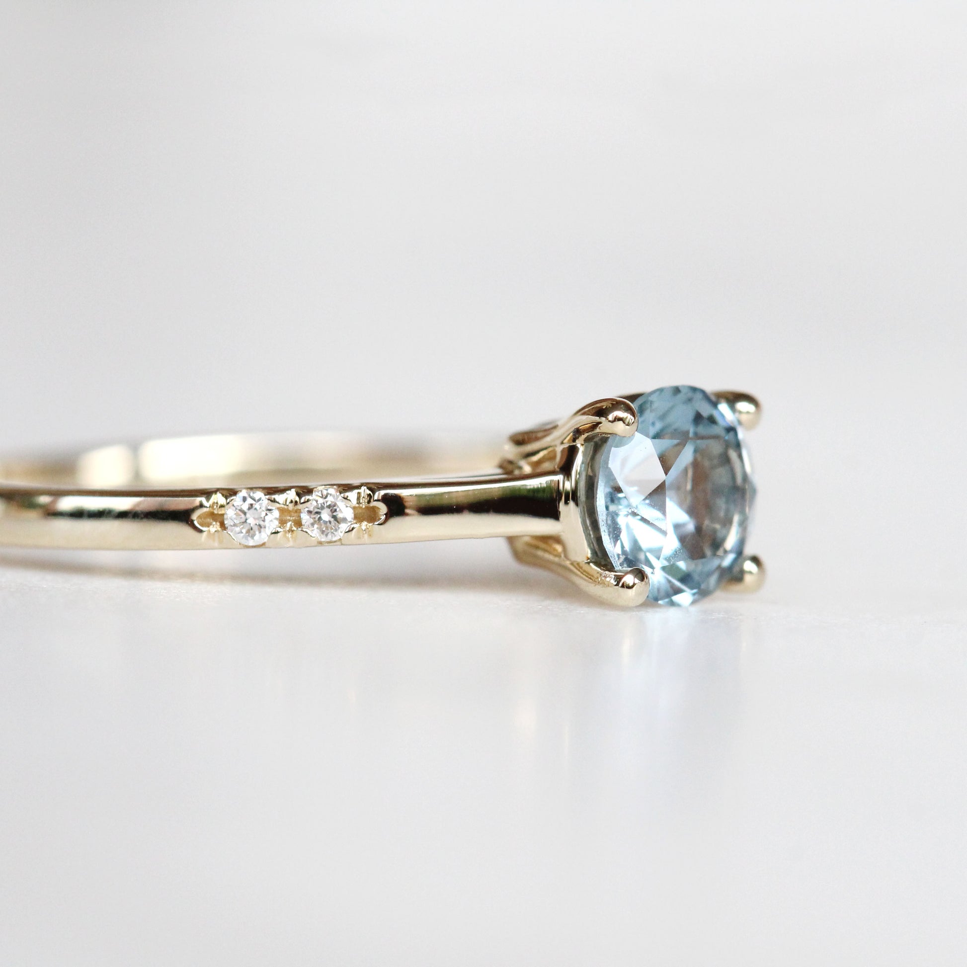 Xavier Ring with a 0.69 Carat Blue Sapphire and Three Asymmetrical White Diamond Accents in 14k Yellow Gold - Ready to Size and Ship - Midwinter Co. Alternative Bridal Rings and Modern Fine Jewelry