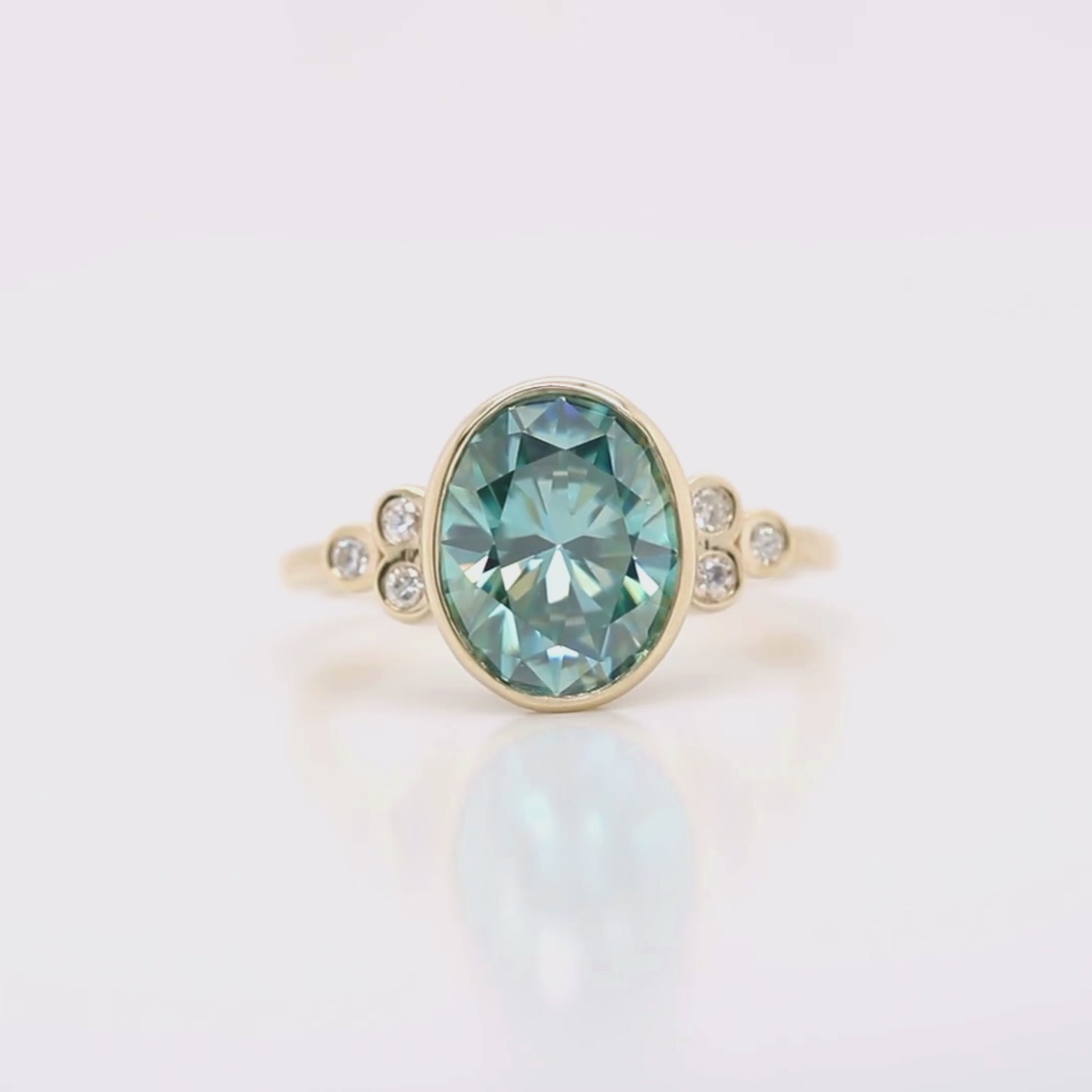 Project: Custom Sophia Ring with a 2.5 Carat Bezel Set Teal Oval Moissanite and Accent Diamonds in 14k